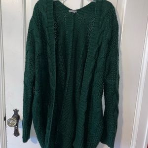 Large, green sweater.